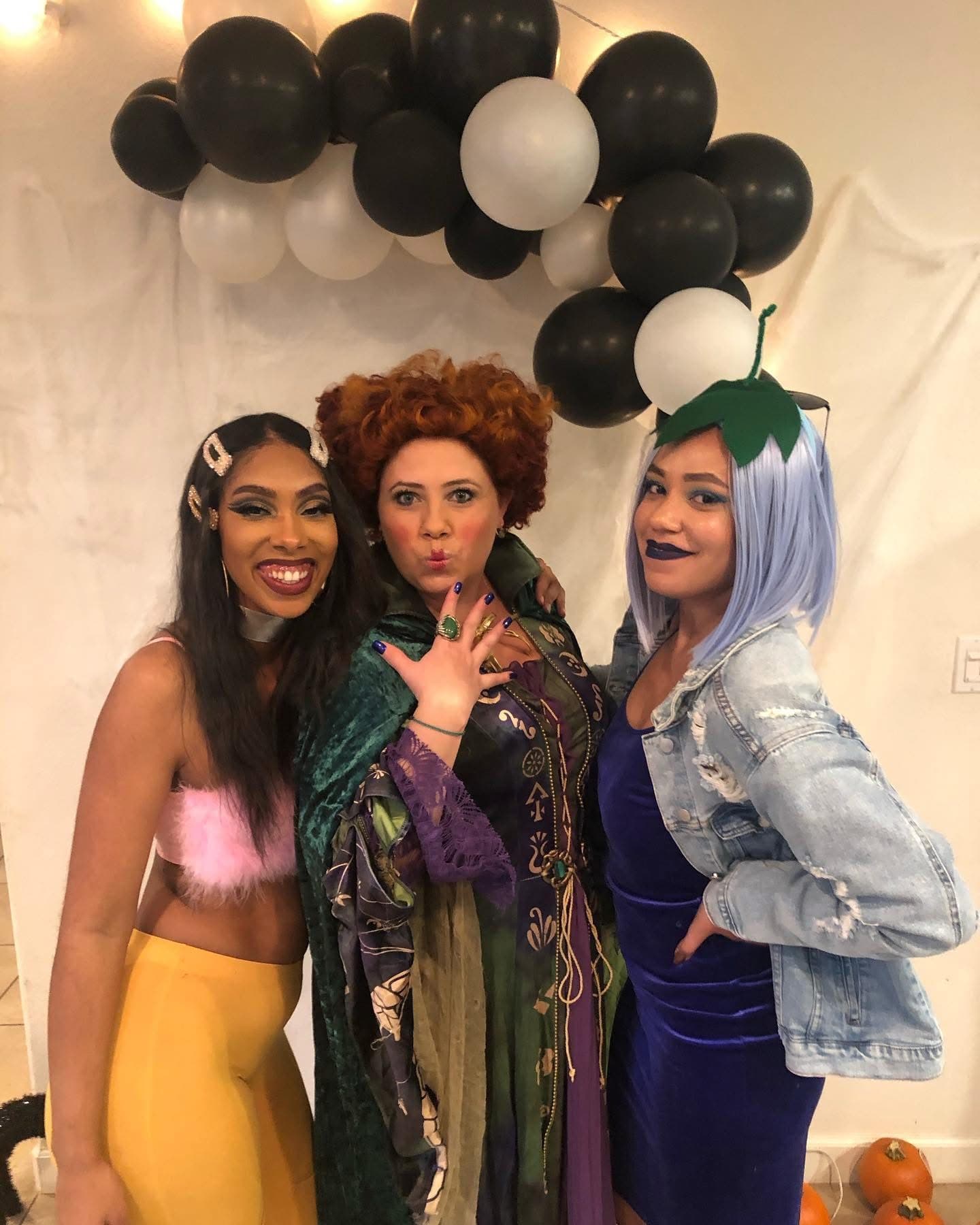 Family and friends posing together in festive costumes